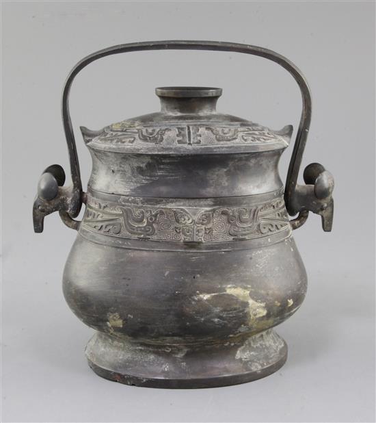 A Chinese archaic bronze ritual wine vessel and cover, You, late Shang/early Western Zhou dynasty, 11th century B.C., 22cm high, repair
